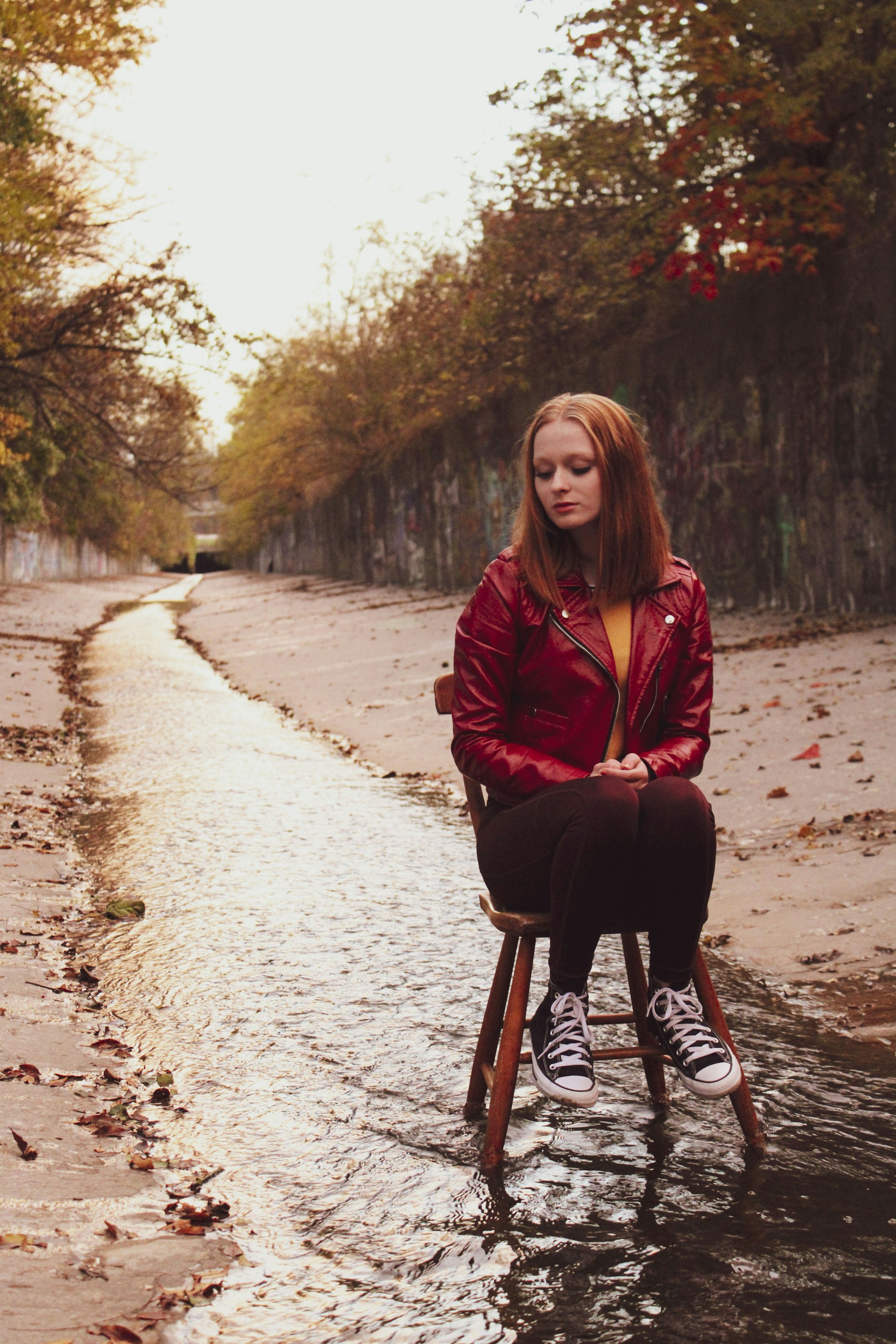 a woman sitting on a chair in the water