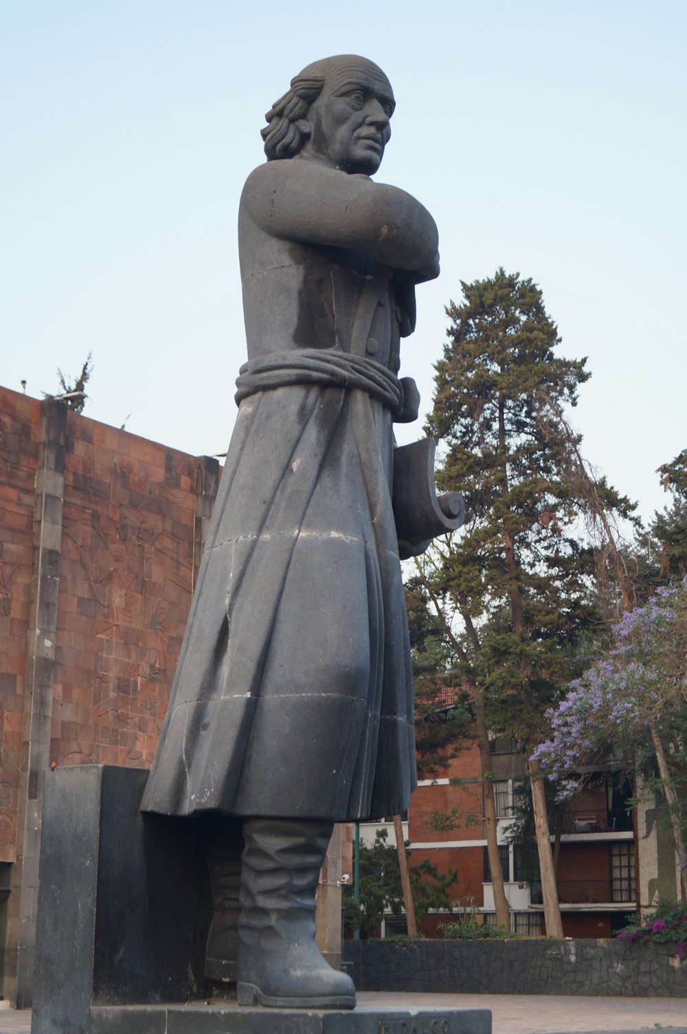 a statue of a man with a cane