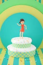 a little girl standing on top of a cake