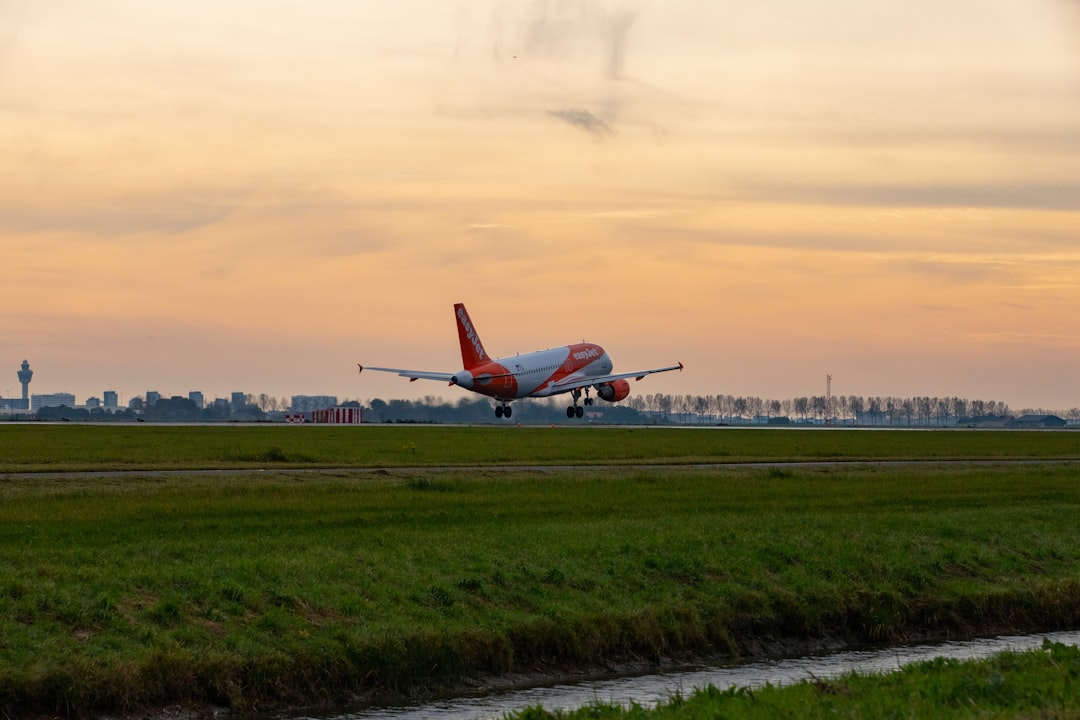 a large jetliner taking off from an airport runway,