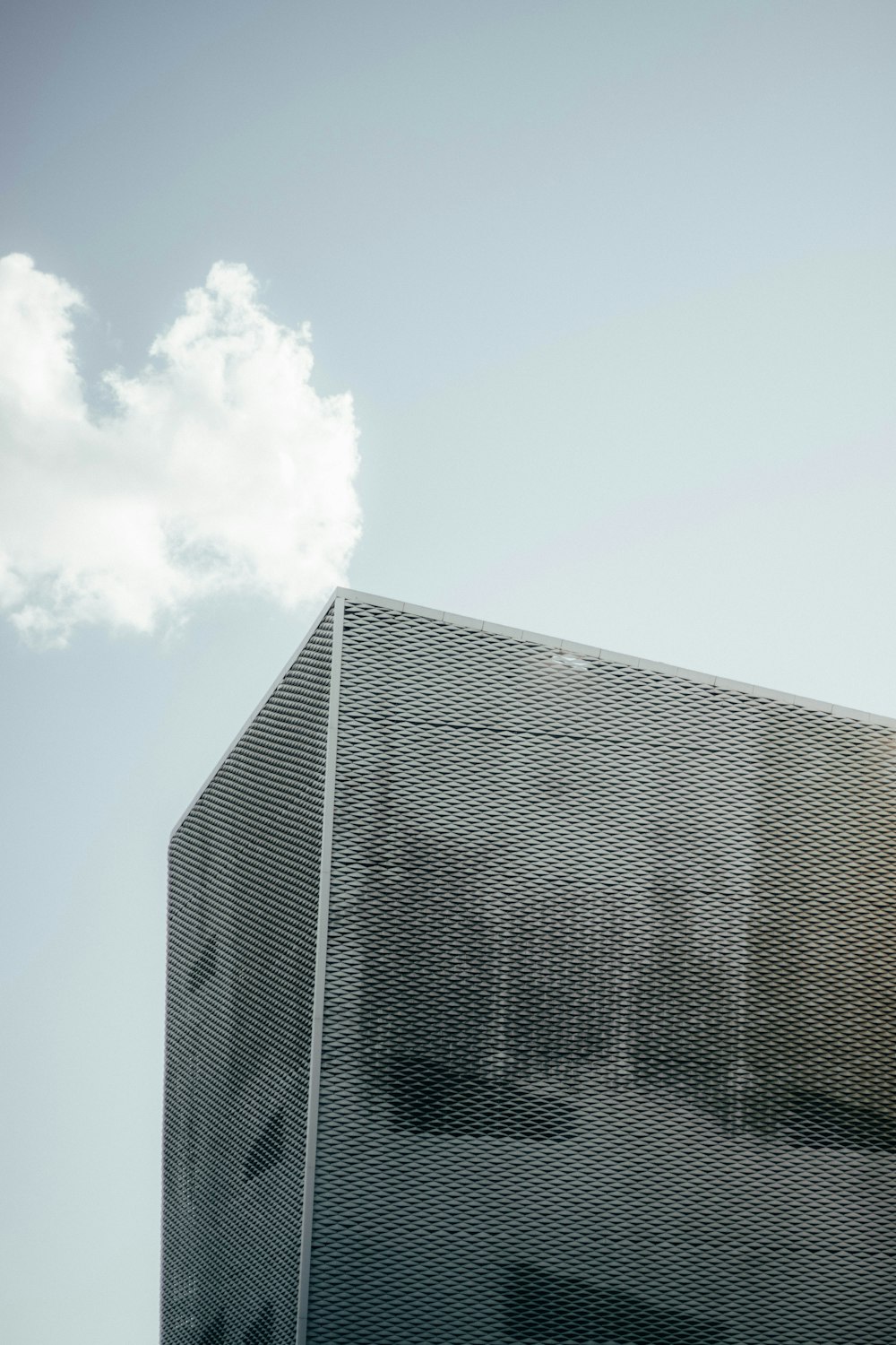 a tall building with a sky in the background