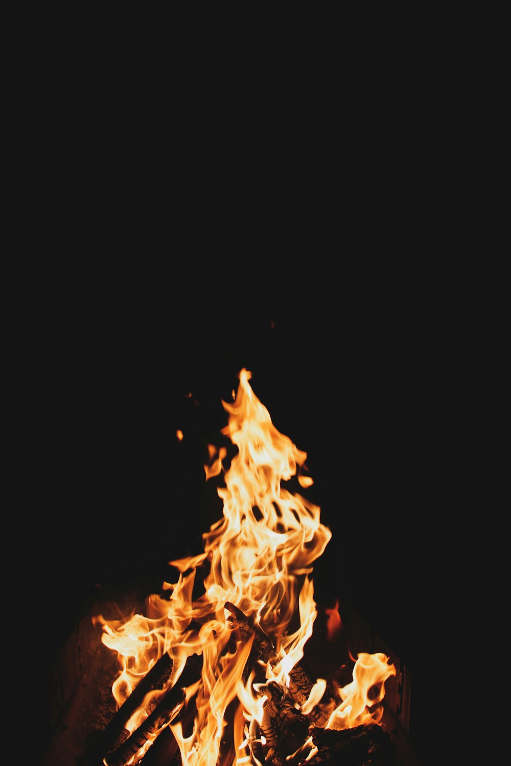 a close up of a fire in the dark