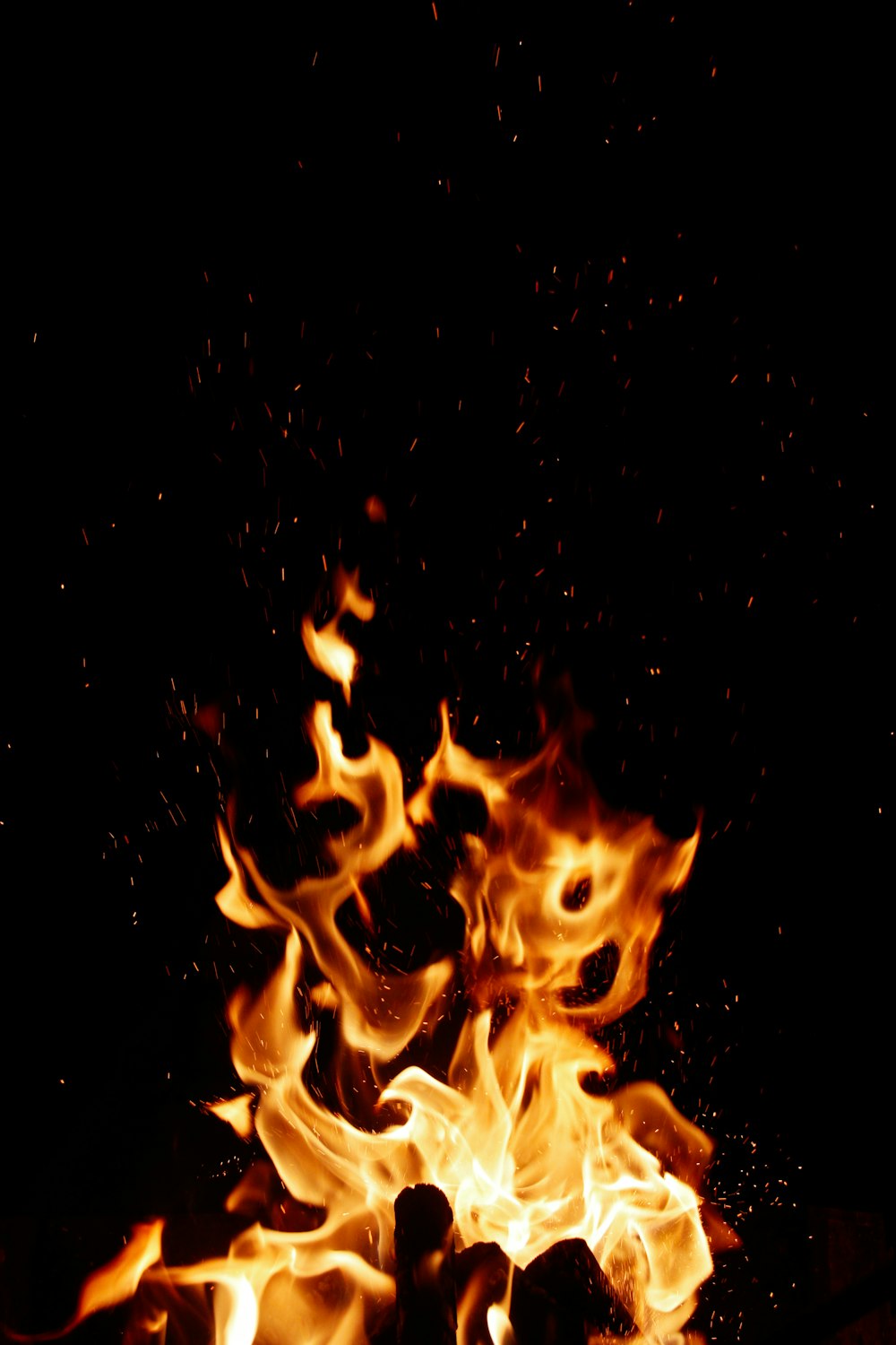 a close up of a fire in the dark