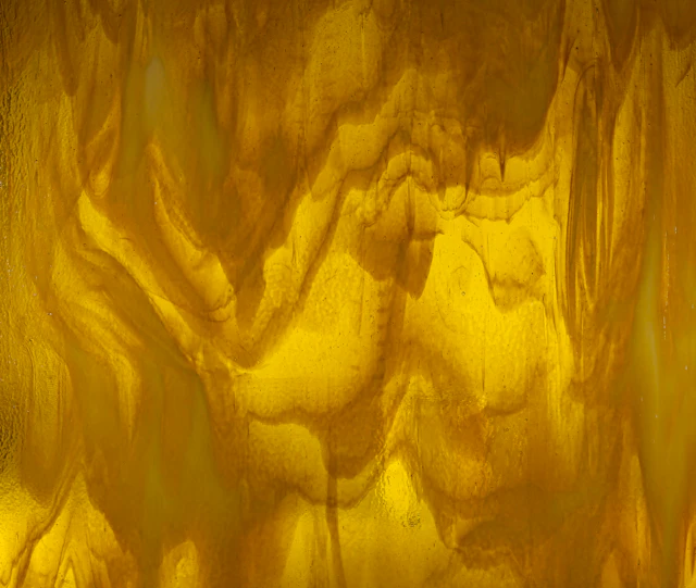 Close-up of golden onyx lit from behind