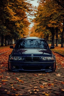 a black car parked on the side of a road