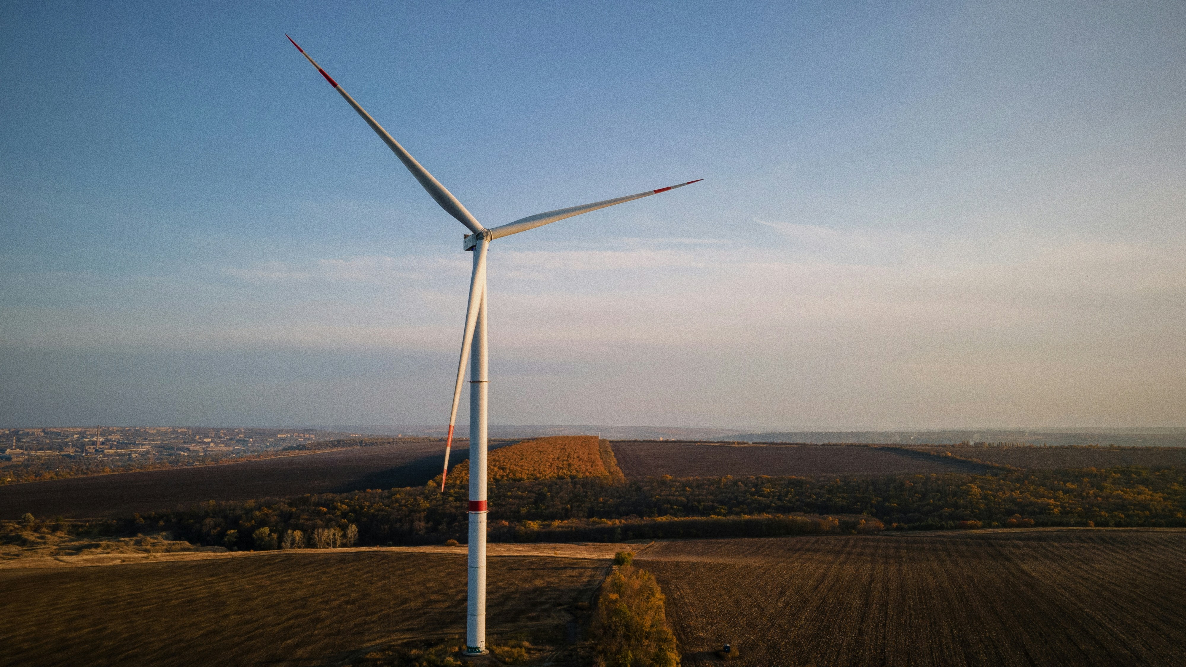 A wind turbine in the middle of a field photo – Free Forest Image on ...