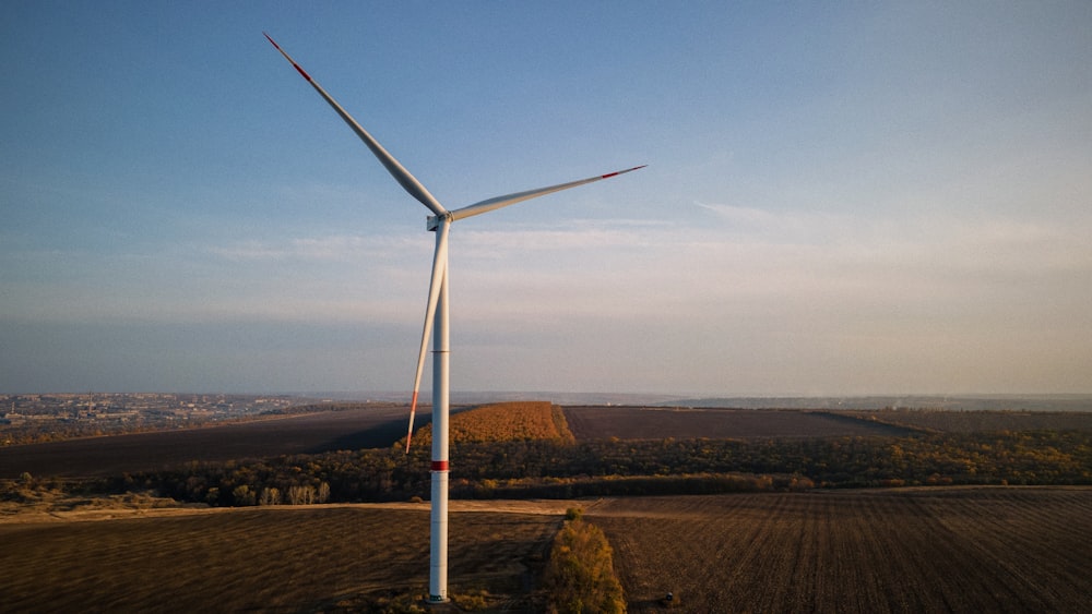 a wind turbine in the middle of a field