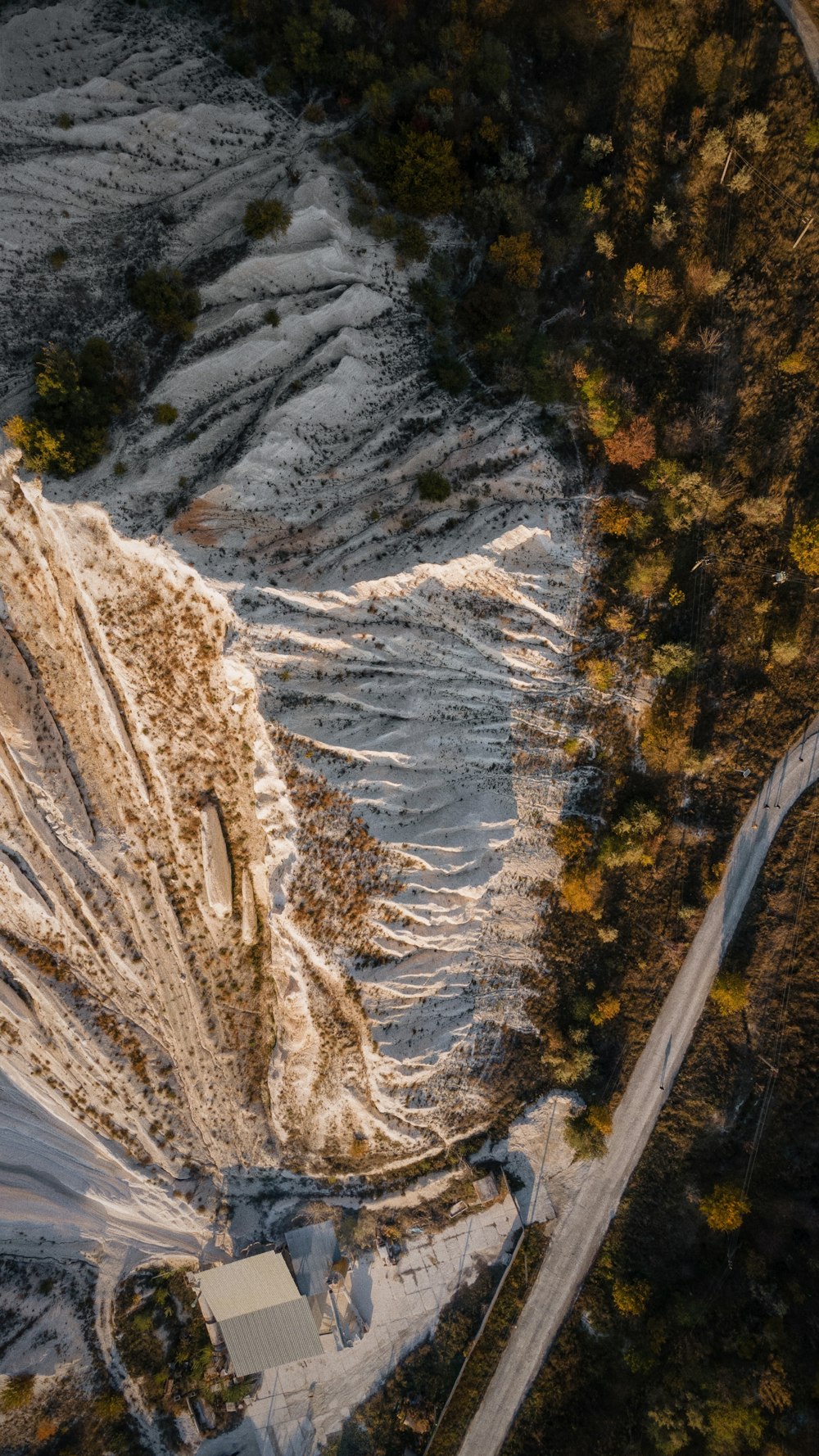 an aerial view of a snow covered road