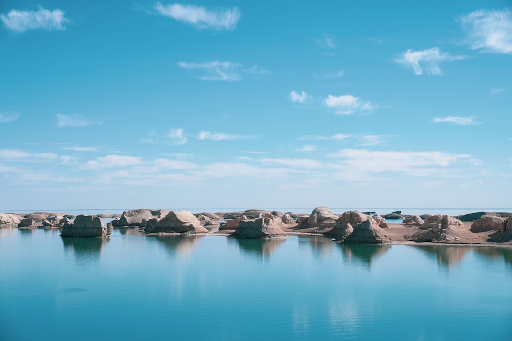 a large body of water surrounded by rocks