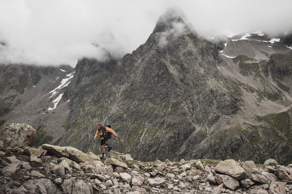 a man riding a mountain bike on a rocky trail