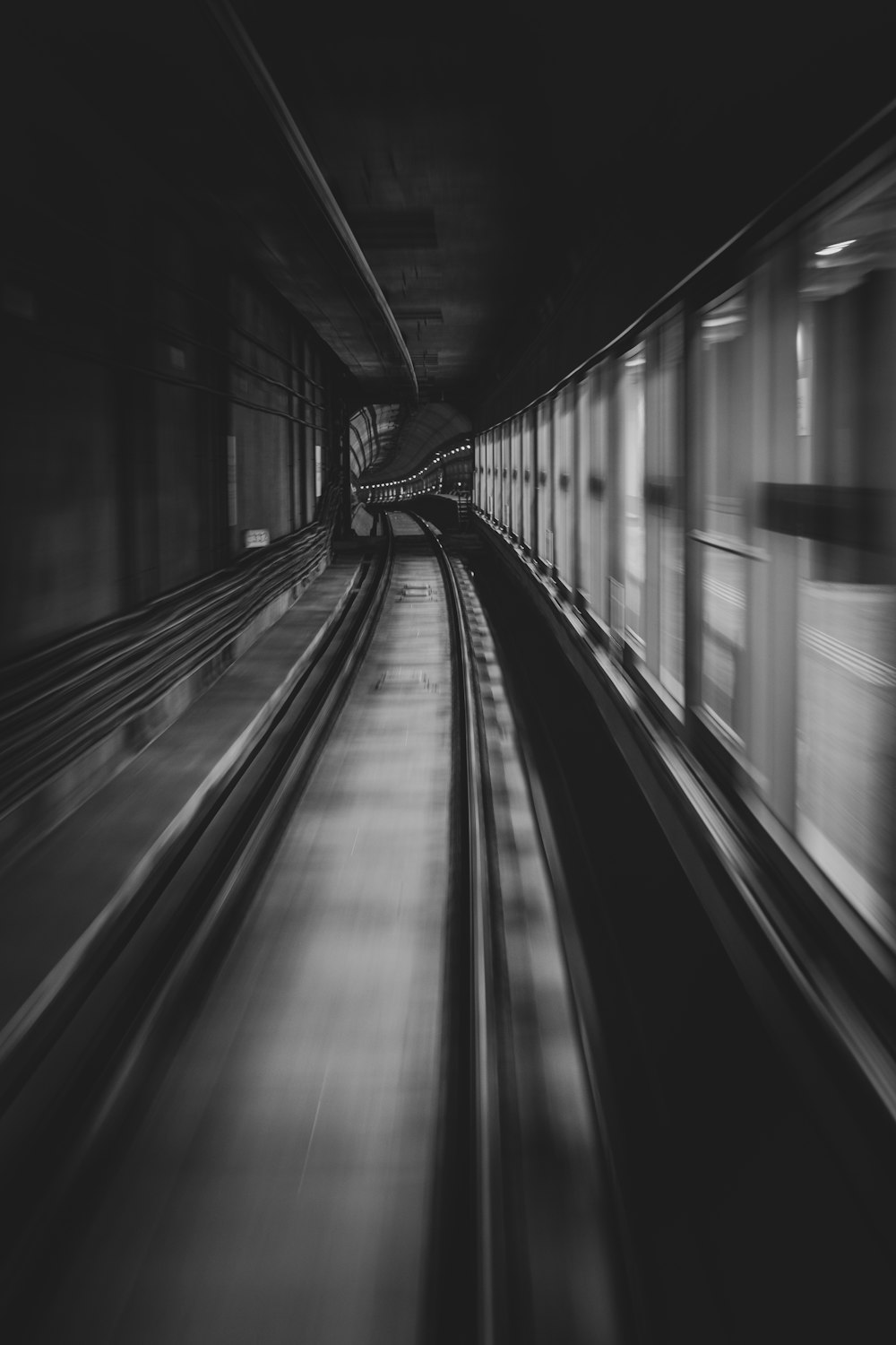 a black and white photo of a train station