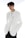 A person with short dark hair wearing a stylish white blazer adorned with decorative chains. The individual is also wearing sunglasses on their head and a plain white shirt underneath. The background is bright, enhancing the minimalist and modern fashion aesthetic conveyed.
