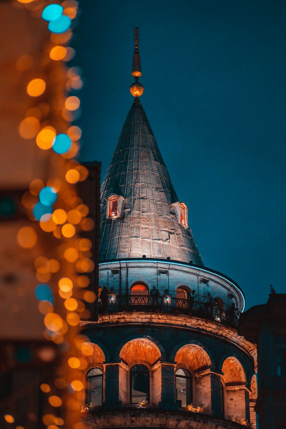 a very tall building with a clock on it's side