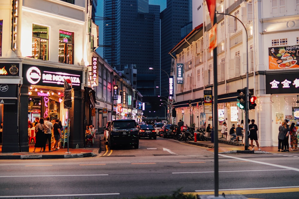 a city street filled with lots of tall buildings