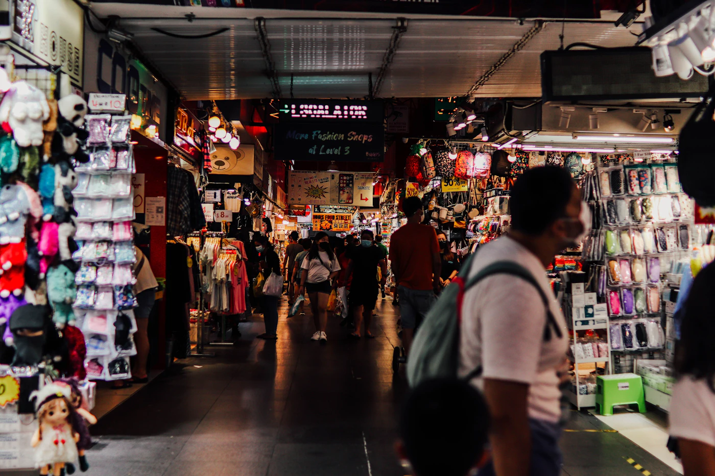 Shoppers walking through the aisles of a crowded store