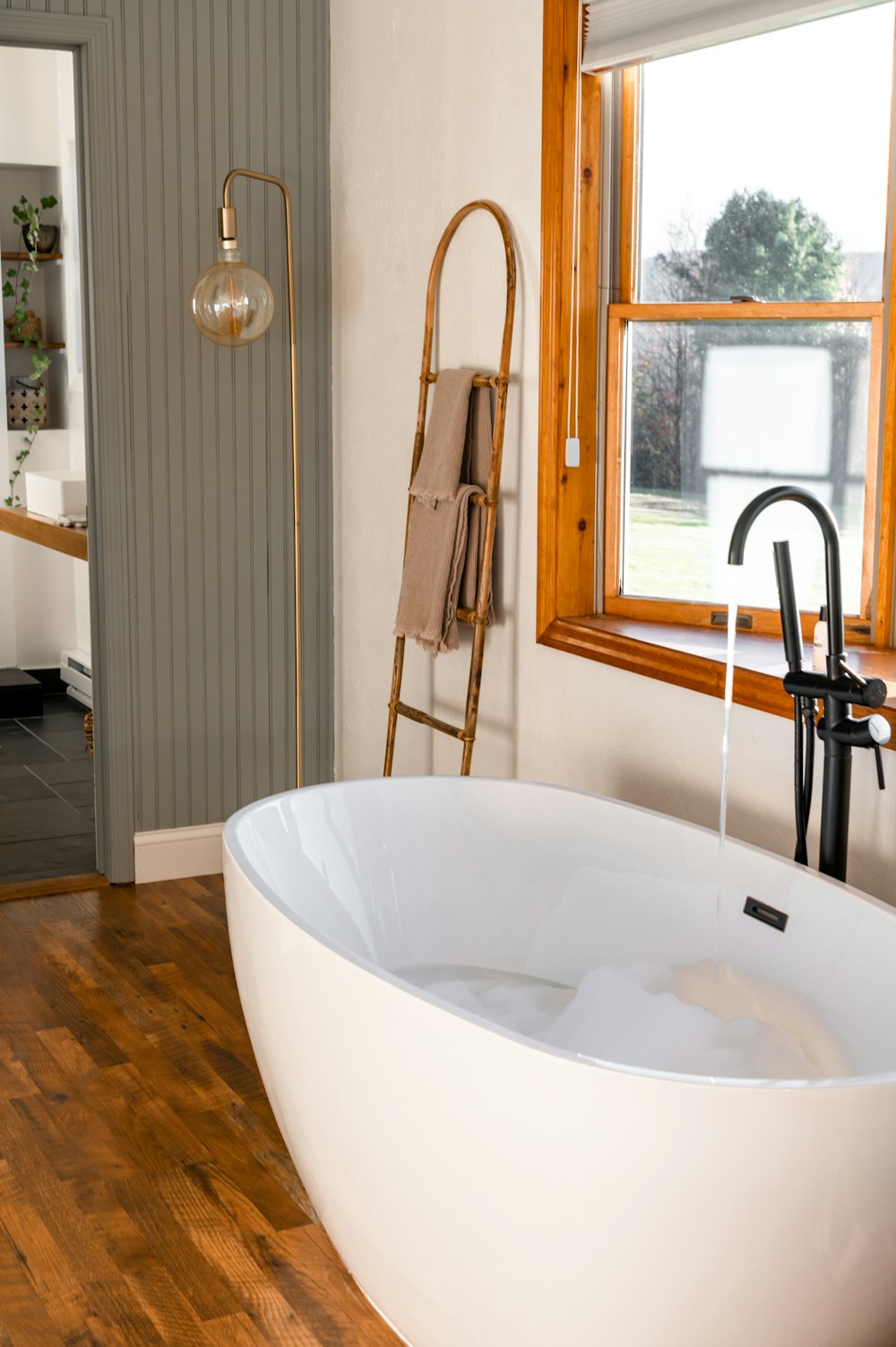 a large tub next to a sink