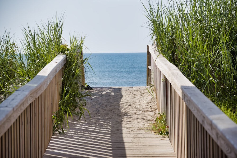 a wooden walkway leading to the beach
