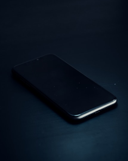 a close up of a cell phone on a table