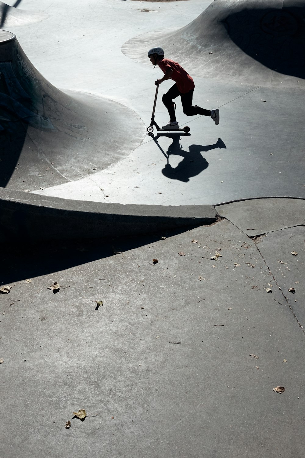 a man riding a skateboard down the side of a ramp