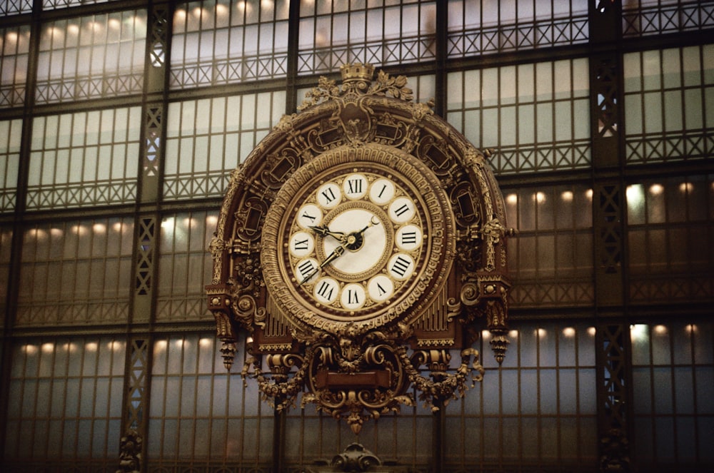 a large ornate clock in front of a window