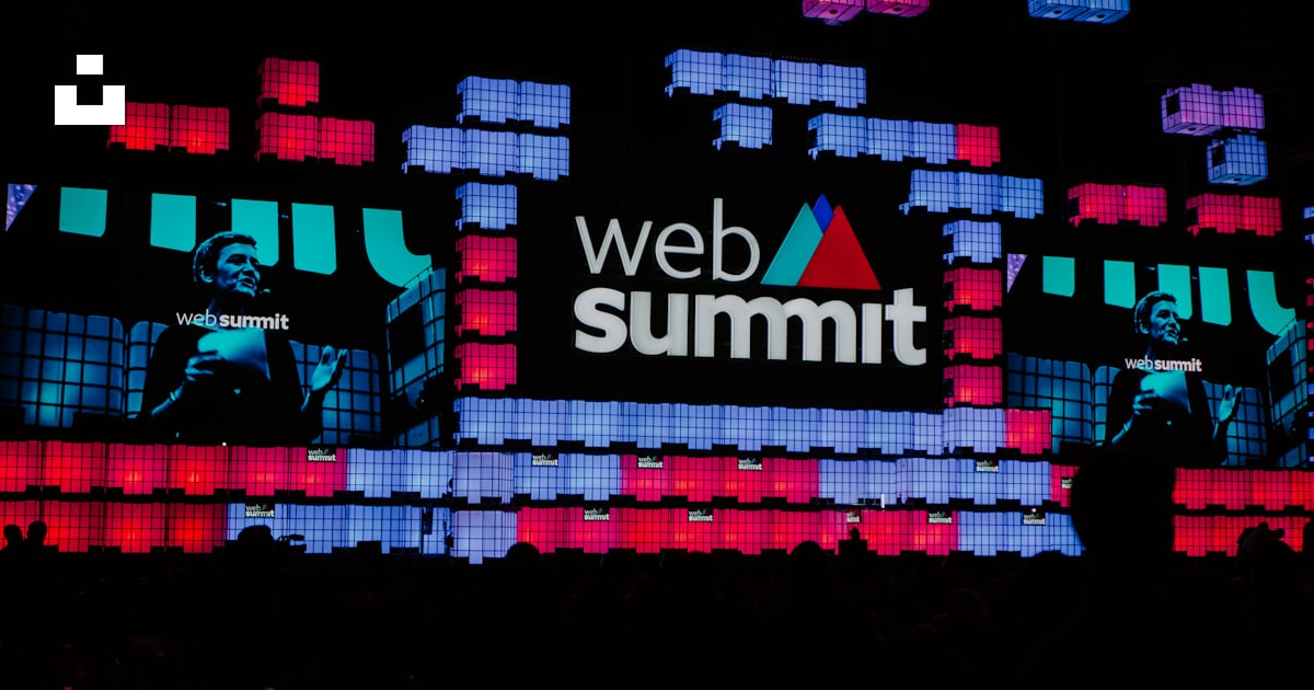 A large screen with a web summit logo on it photo – Free Lisbon Image ...