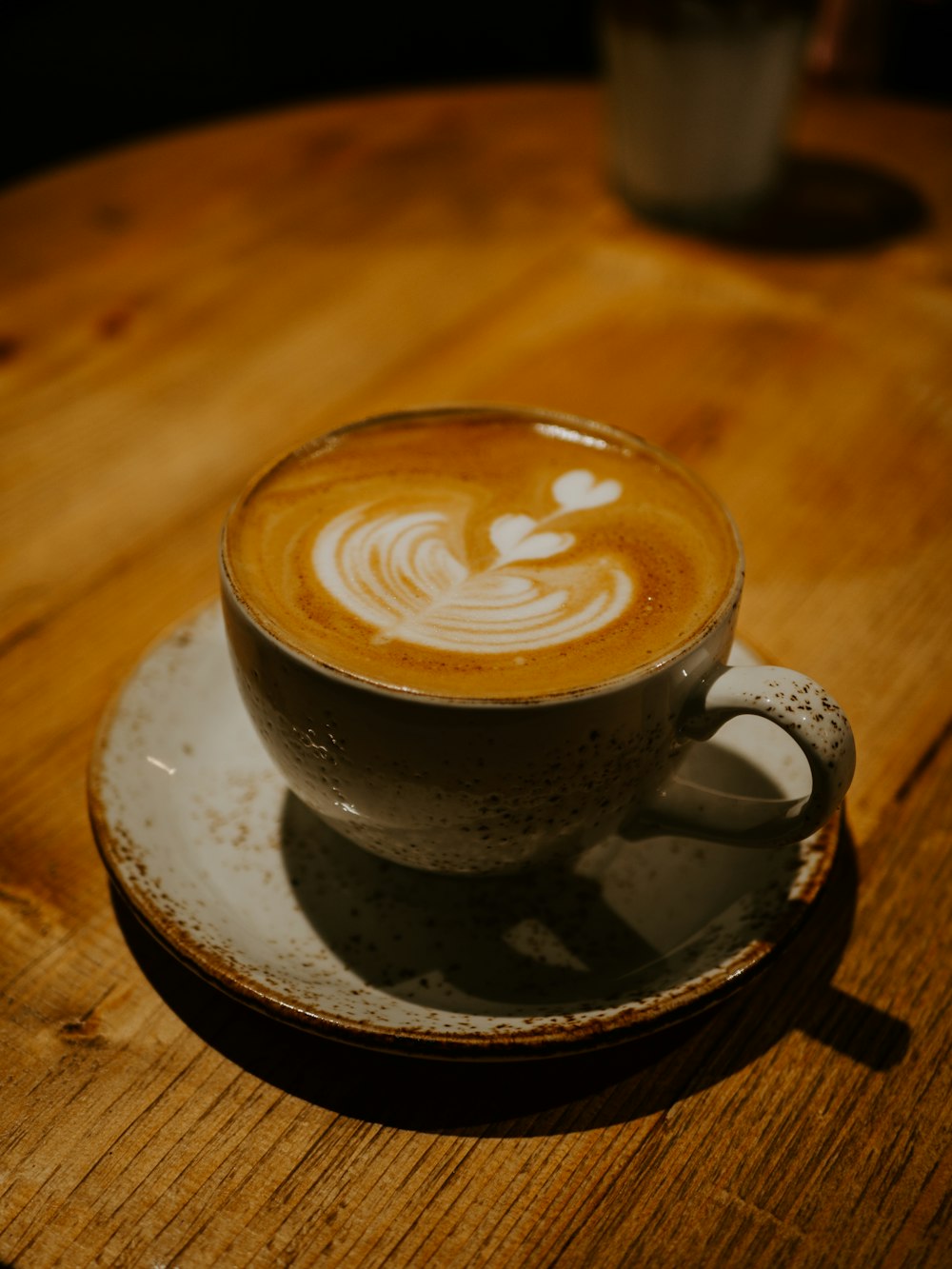 a cup of coffee sitting on top of a saucer