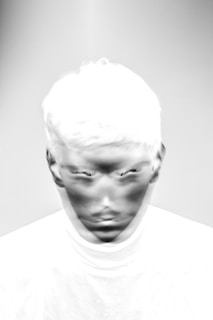 a black and white photo of a man's face