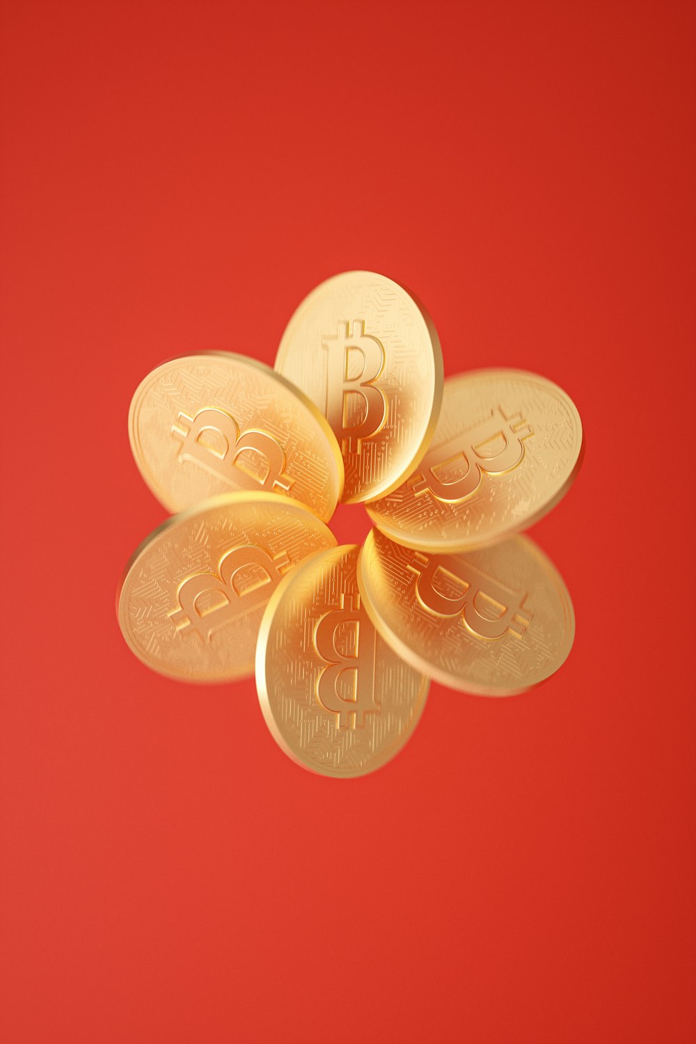 un fiore fatto di monete d'oro su uno sfondo rosso