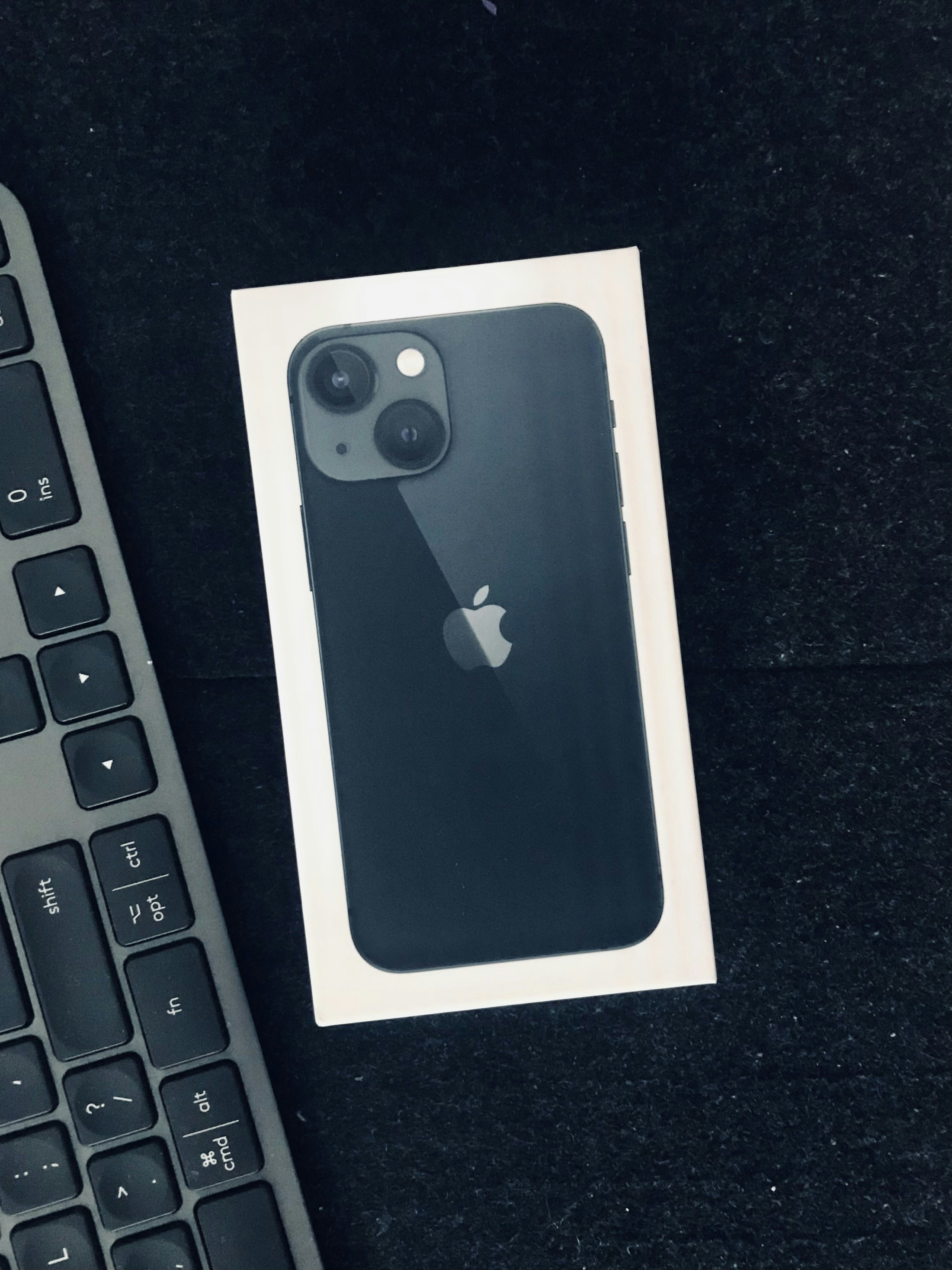 iPhone 13 in midnight color, clean product photograph