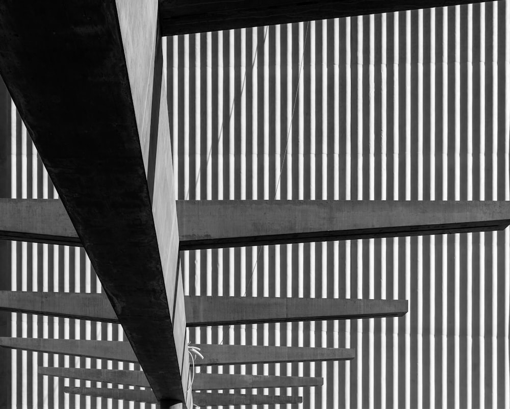 a black and white photo of the underside of a bridge