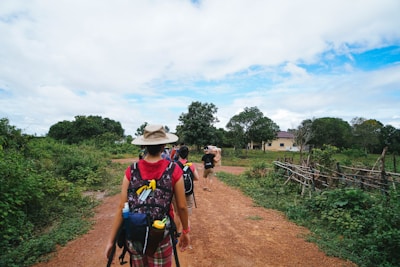 a man riding a bike down a dirt road