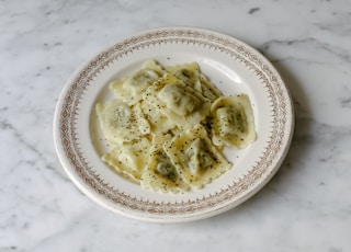 Plate of ravioli on a marble table