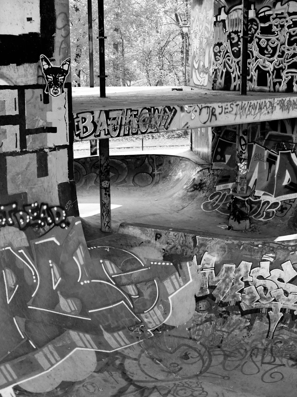 a black and white photo of a skate park