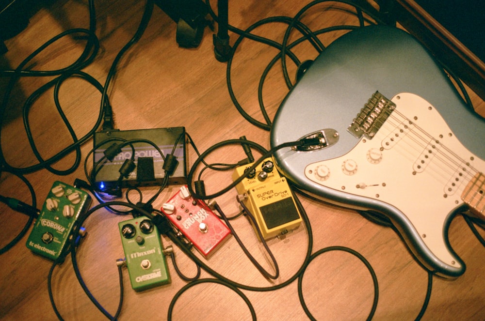 a guitar and other musical equipment on a table