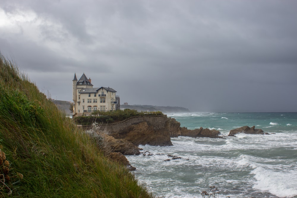 a house on a cliff overlooking the ocean