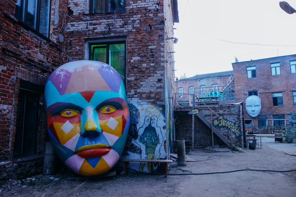 a large face painted on the side of a building