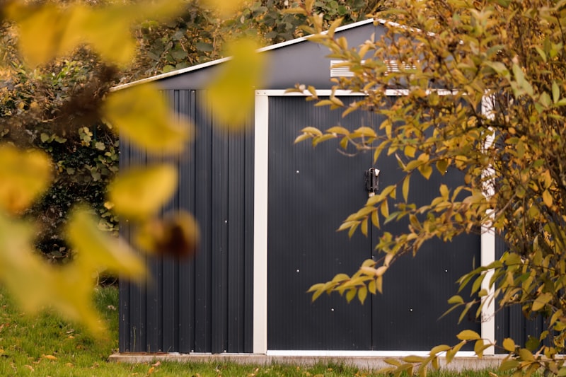 Small shed with a window and door in a garden