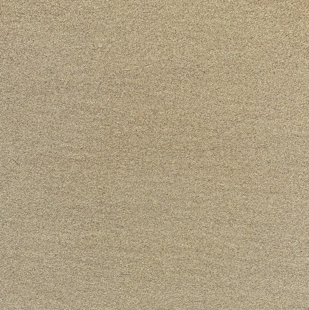 a beige area rug with a white border