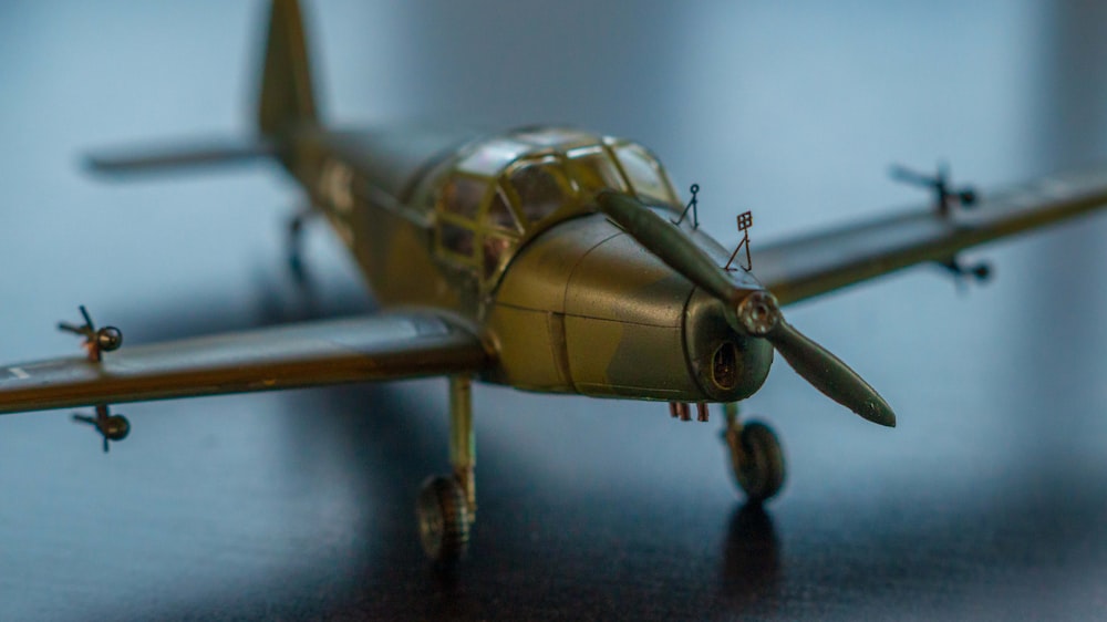 a model airplane sitting on top of a wooden table