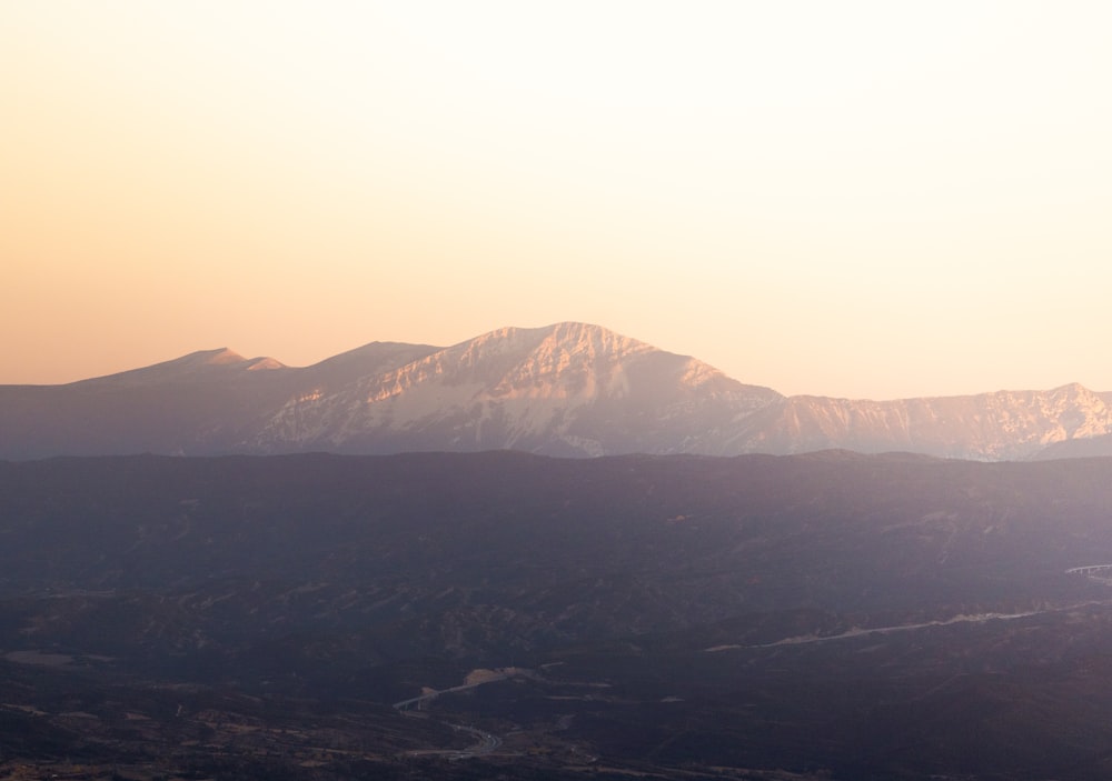 a view of a mountain range at sunset