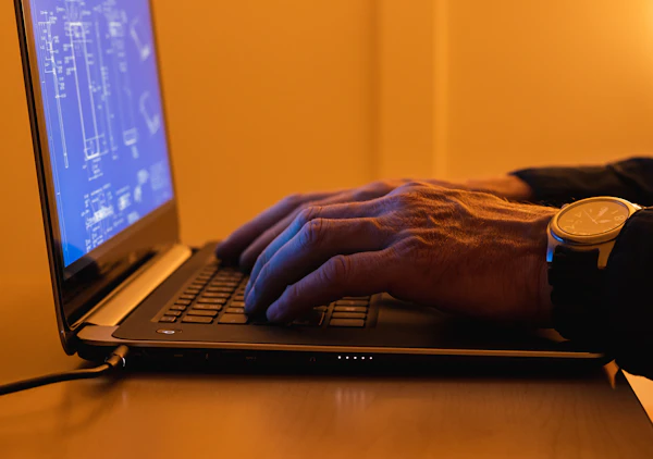 Technical blueprint drawings on laptop