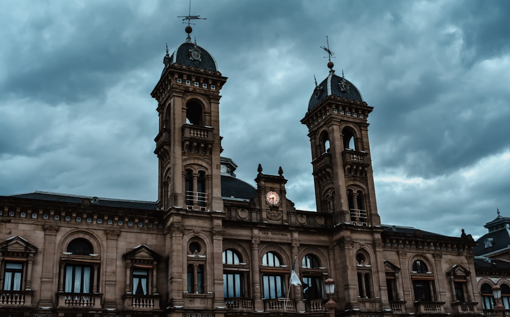 a large building with two towers and a clock