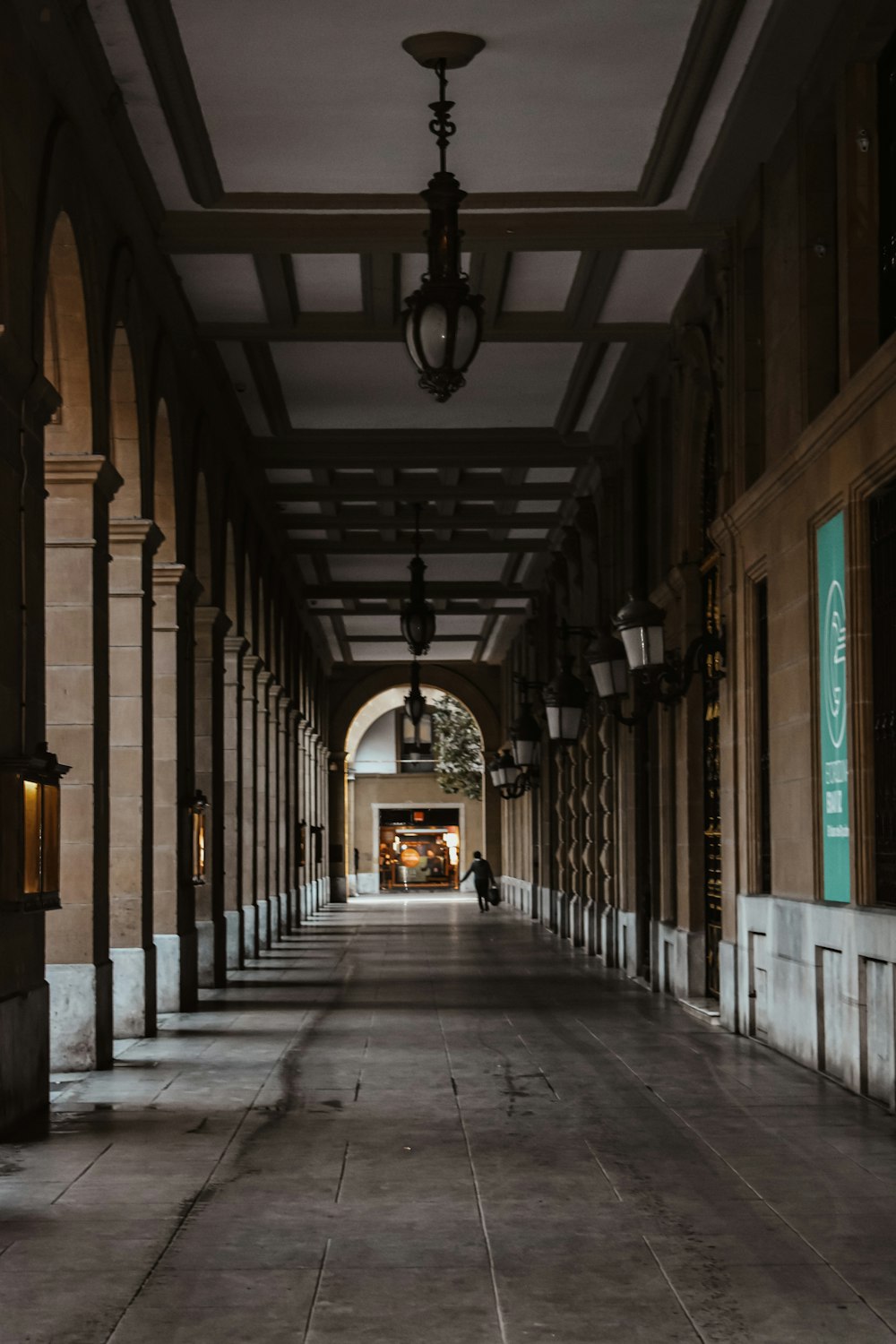 a long hallway with a clock on the wall