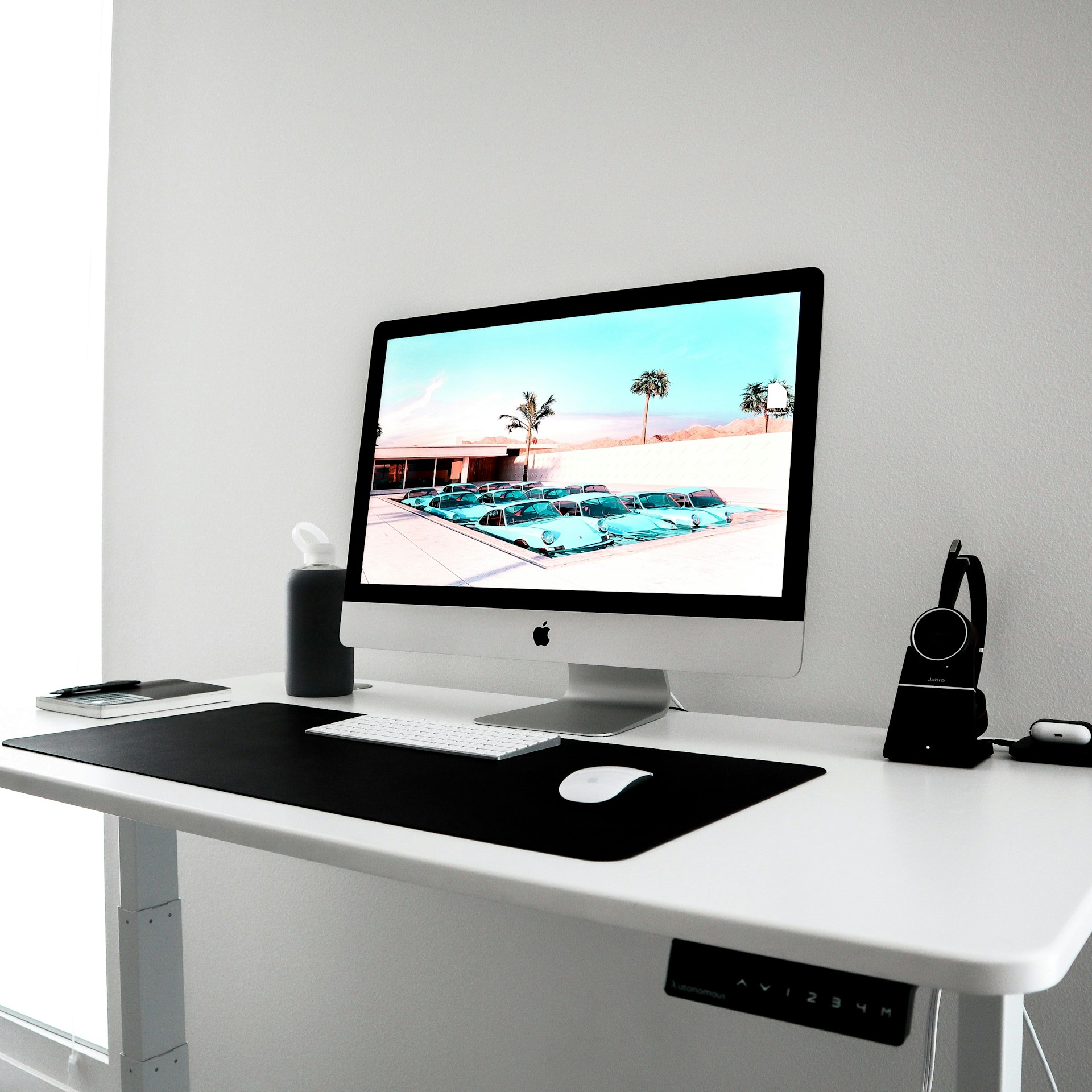 a desktop computer sitting on top of a white desk