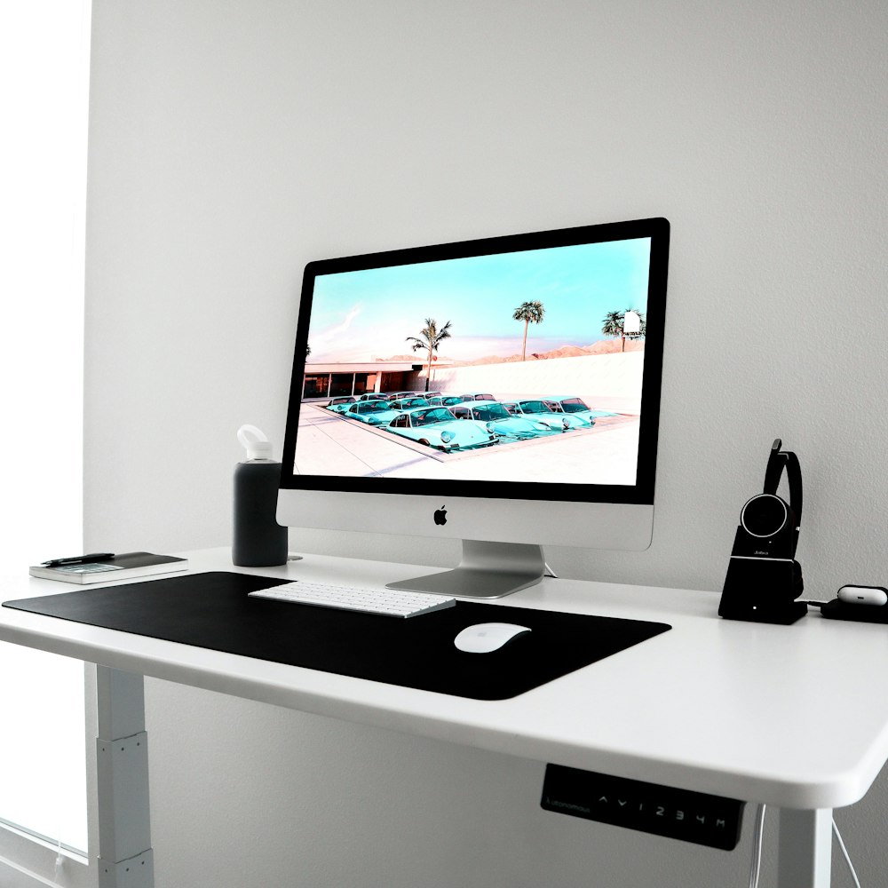 a desktop computer sitting on top of a white desk