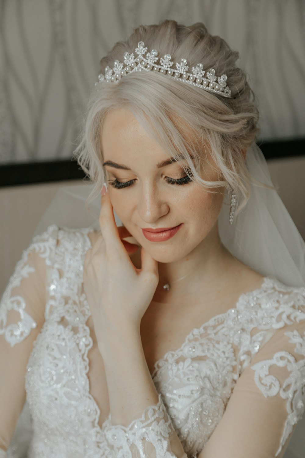 a woman in a wedding dress with a tiara