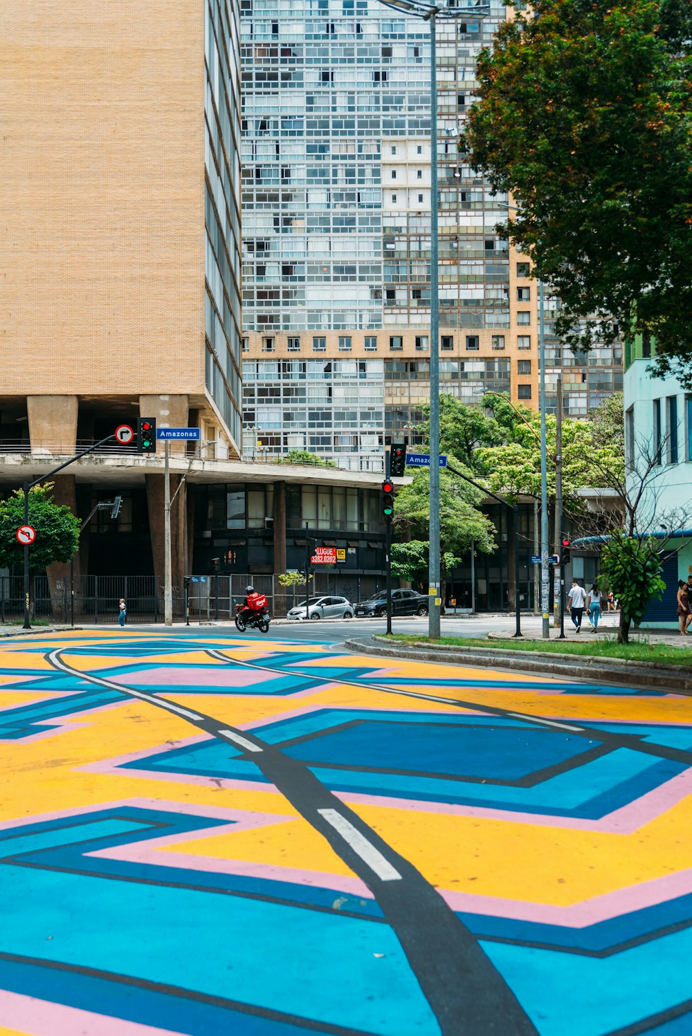 a city street painted with a multicolored pattern