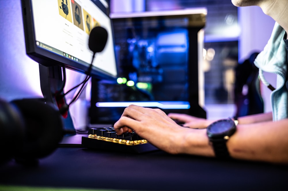 a person is typing on a computer keyboard