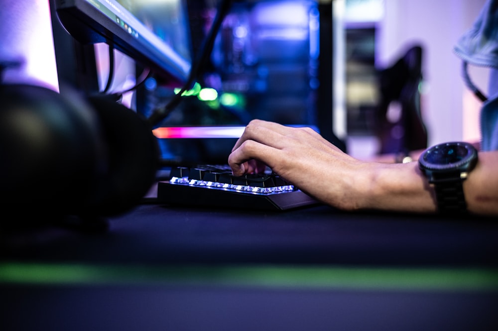 a person is typing on a laptop computer