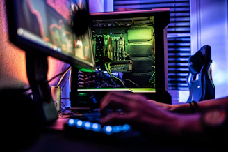 a person working on a computer in a dark room